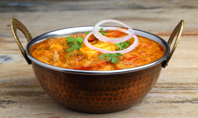Indian Food or Indian Curry in a copper brass serving bowl.