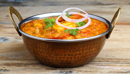 Indian Food or Indian Curry in a copper brass serving bowl.