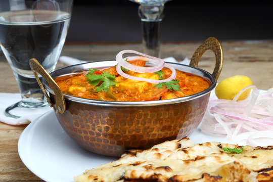 Indian Food or Indian Curry in a copper brass serving bowl.