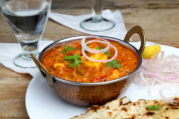 Indian Food or Indian Curry in a copper brass serving bowl.