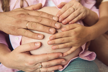 Man embracing his pregnant wife