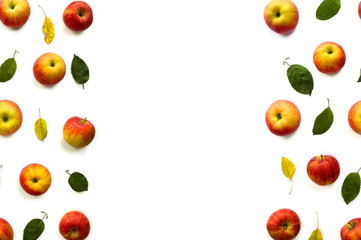 Ripe yellow red juicy apples and leaves apple tree on white background with space for text. Top view, flat lay