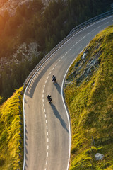 Motorcycle drivers riding in Alpine highway. Outdoor photography