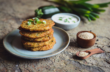 Quinoa fritters with zucchini, garlic and green onion served with yoghurt dip