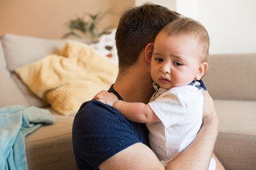 Father comforting crying baby