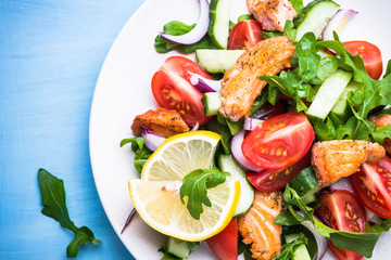 Fresh salad with salmon and vegetables.