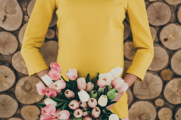 pregnancy woman belly with flowers in hands