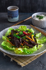 Fried turkey liver asian style with vegetables and many greens. Served with bowl of rice and tea