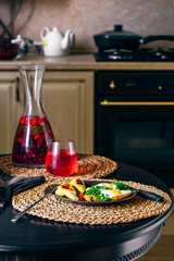 Breakfast with Scambled Eggs, and Infused Water with Berries.