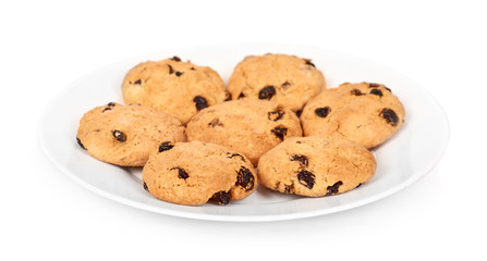 Pile of chocolate chip cookies on a dish isolated on white background