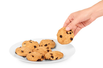 Pile of chocolate chip cookies on a dish in hand isolated on white background