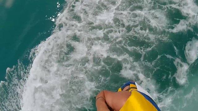paragliding and parasailing lifestyle. man and boy are flying on a parachute over the sea. Extreme sport first-person view ocean video