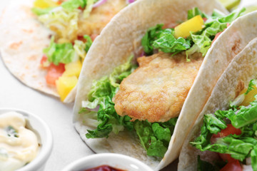 Delicious fish tacos on cooking sheet