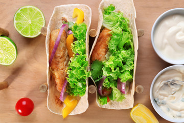 Holder with delicious fish tacos, top view