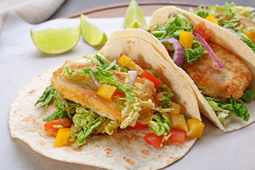 Delicious fish tacos on cooking sheet