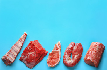 Pieces of different fresh meat on color background