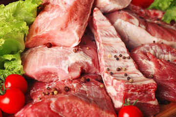 Pieces of different fresh meat with spices, closeup