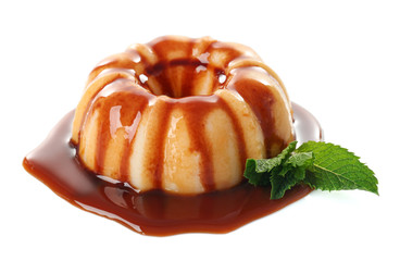 Delicious vanilla pudding with chocolate syrup on white background