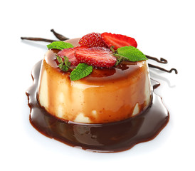 Delicious vanilla pudding with chocolate syrup on white background
