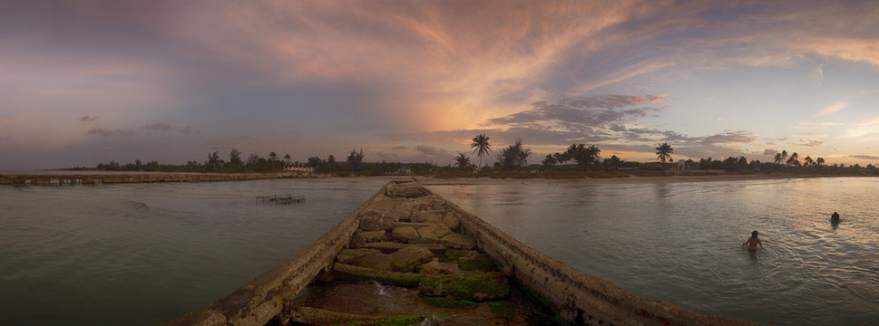 Panoramic view of shore and destroyed pier in Guanabo beach, Cuba