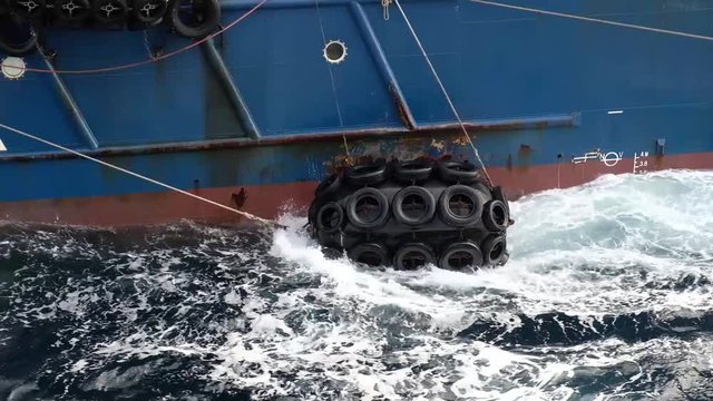 Mooring of the ship_.tyres for mooring on the waves