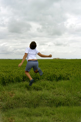 Boy and  green field...