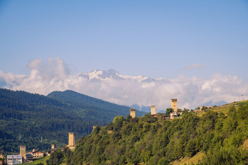 Fototapeta na wymiar Landscape view of stone watchtowers and mountains in Mestia village, Georgia