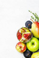 Fruit cold sangria with figs and pink wine, white background, top view