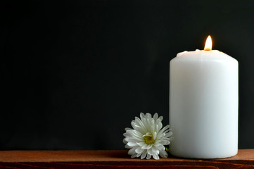 Condolence card with white burning candle and flower