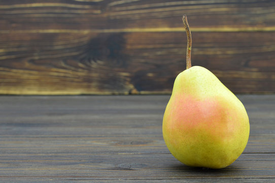 Pear on wooden background