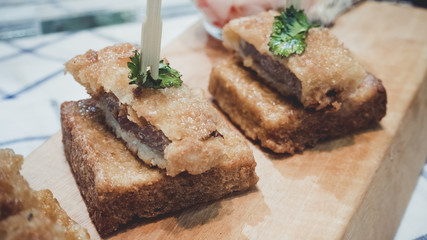 Tonkatsu pork cutlet is a Japanese dish which consists of a breaded, deep fried pork cutlet. There are two main types, fillet and loin. It is often served with shredded cabbage.