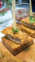 Tonkatsu pork cutlet is a Japanese dish which consists of a breaded, deep fried pork cutlet. There are two main types, fillet and loin. It is often served with shredded cabbage.