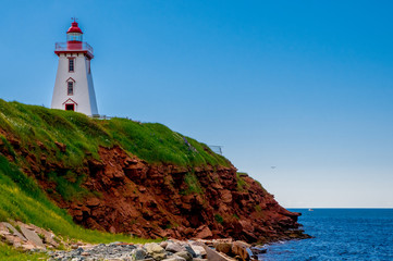 Fototapeta na wymiar Lighthouse on the cliff at Souris, Prince Edward Island