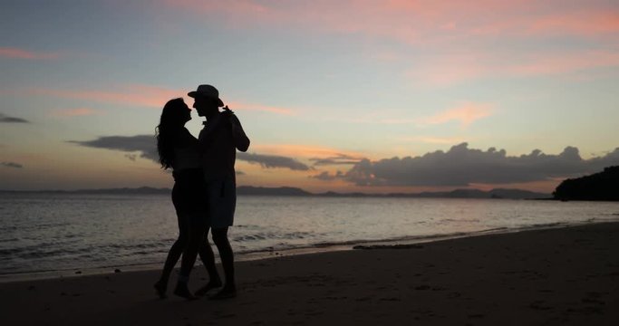 Couple Dancing On Beach At Sunset, Young Man And Woman In Love Happy Tourists On Romantic Trip Sea Vacation Slow Motion 60