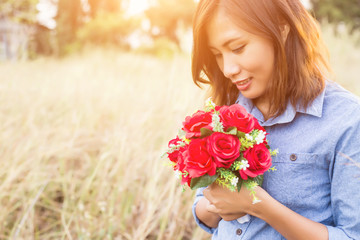 Fototapeta premium Freshly cut flowers in woman's hand