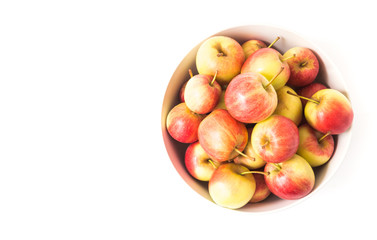 Closeup top view red apple on white bowl with white background, fruit healthy concept