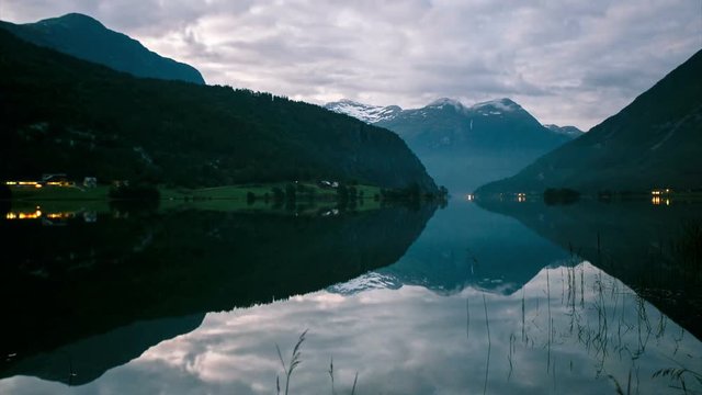 Amaizing time-lapse of night to day in Mindresunde Camping Norway with foggy morning