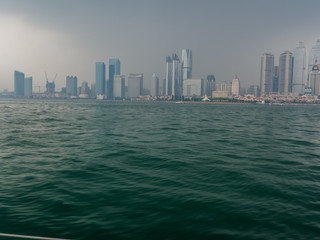 Fototapeta premium Urban architecture over sea with reflection.