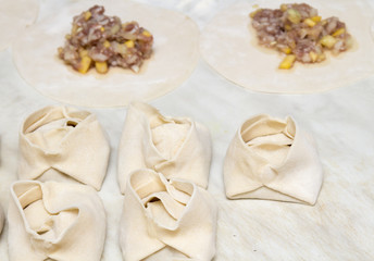 steamed dumplings of dough with meat
