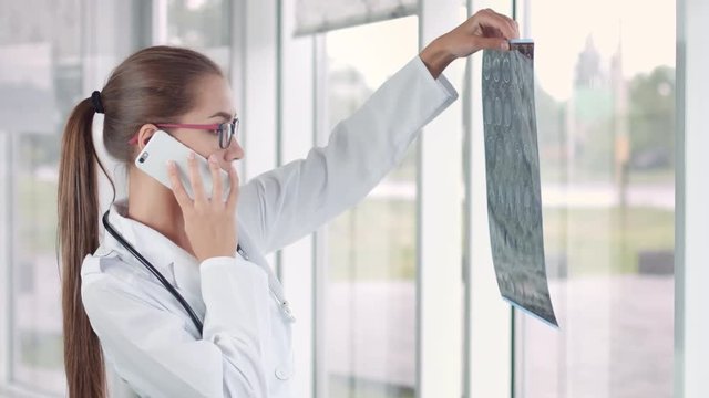 Radiologist view mri brain scan and call patient