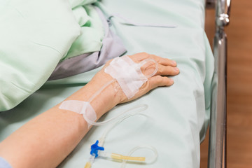 Close up Hand of a patient in Hospital ward, Patient Health Care concept.