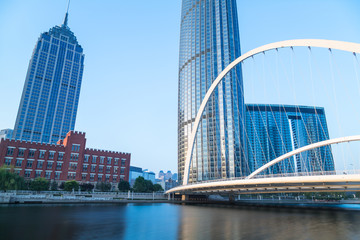 Fototapeta premium Tianjin Hai river waterfront downtown skyline with Dagu bridge,China.