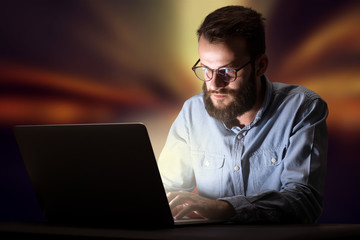 Businessman in the office at night