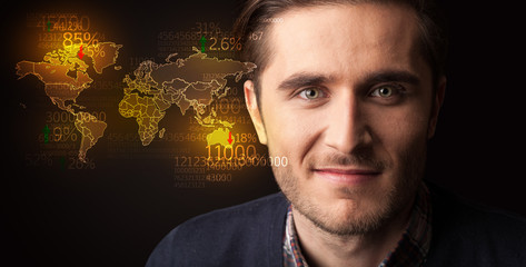 Portrait of a young businessman on dark background