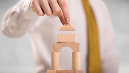 Businessman building a tower