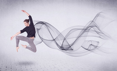 Obraz na płótnie Canvas Modern ballet dancer performing with abstract swirl