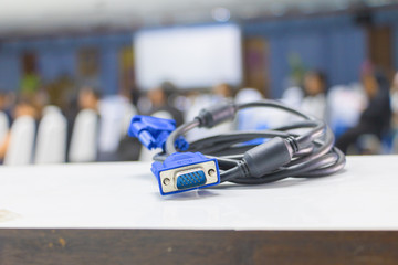 Obraz premium old dirty VGA tech cable connector of computer on table white Blur meeting room background