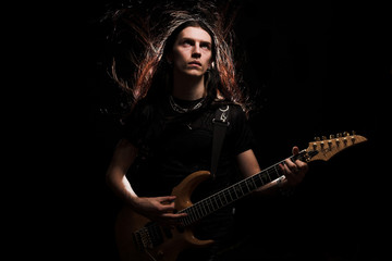 man playing electrical guitar 