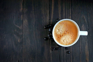 coffee espresso mug with coffee bean on vintage old woods texture