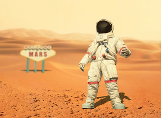 Spaceman walks on the red planet Mars. Space Mission. Welcome to Mars sign. Astronaut travel in space © alones